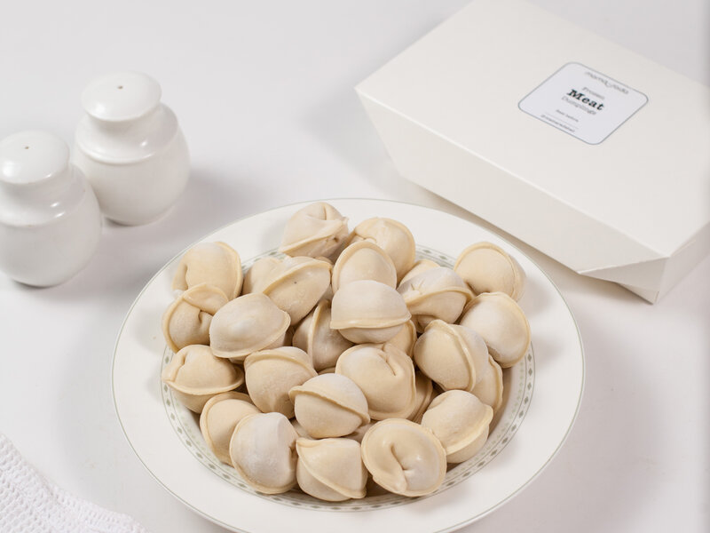 Traditional Russian pelmeni with beef and pork