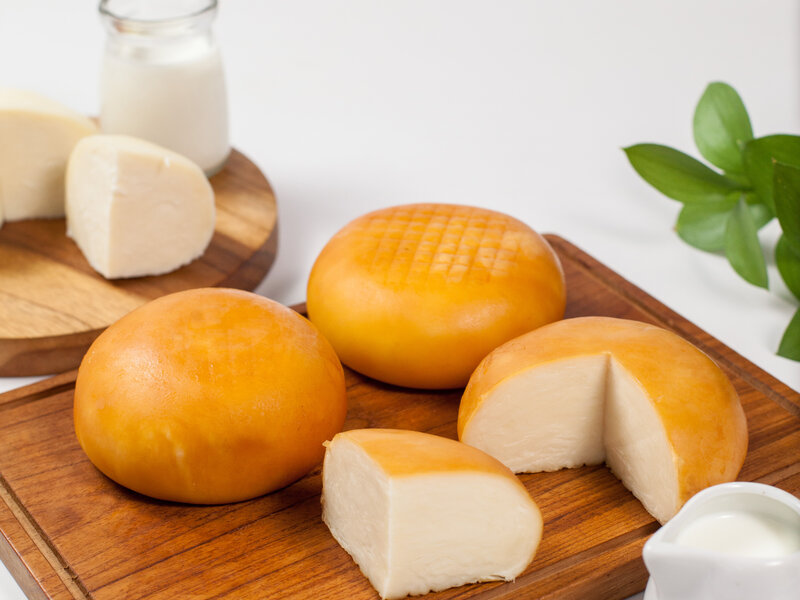 Smoked suluguni Georgian cheese with golden crust
